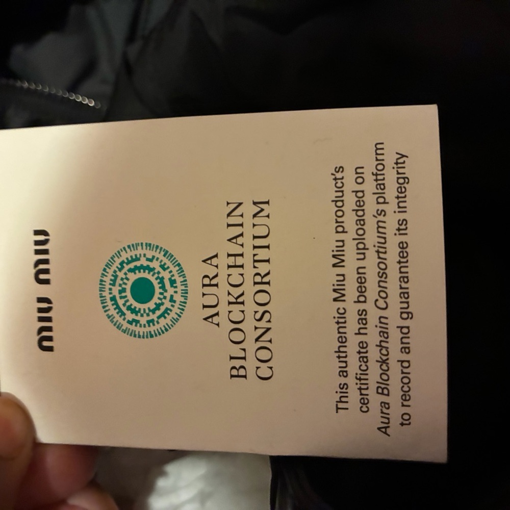 Miu Miu Aura Blockchain Certificate with Black and White Design